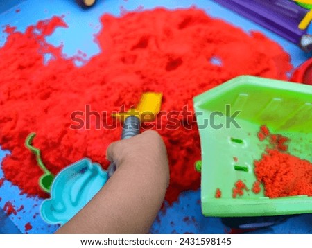 Toy sand and other children's play properties Royalty-Free Stock Photo #2431598145