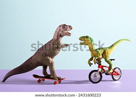 Two happy cute dinosaurs on bike and skate on blue and violet background. 