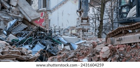 Panorama Excavator demolishing a house Royalty-Free Stock Photo #2431604259
