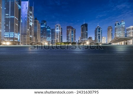 Asphalt road square and modern city building scenery at night in Shanghai. Famous financial district buildings in Shanghai. Royalty-Free Stock Photo #2431630795