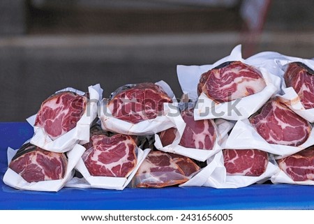 slices of Iberian pork loin Royalty-Free Stock Photo #2431656005