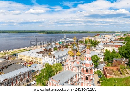 Aerial drone view of Nizhniy Novgorod city center with Volga embankment, Cathedral of the Blessed Virgin Mary Stroganoff church and Kremlin during sunny day, Russia. Royalty-Free Stock Photo #2431671183