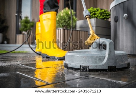 Spring Time Patio Concrete Bricks Pressure Washing Using Powerful Cleaning Power Equipment
