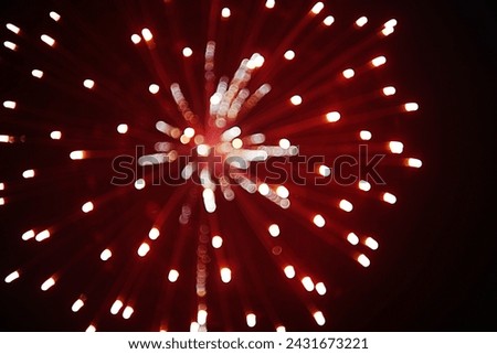 Blurred picture of a fireworks on the sky in the night on the Chinese festival in Phitsanulok province of Thailand.Background texture for use in advertising and banner.