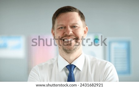 Close-up of smiling middle-aged businessman wearing presentable suit. Copy space in left side. Macro shot of happy employee with shining smile. Business company concept Royalty-Free Stock Photo #2431682921