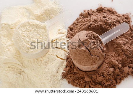 Close up of protein powder and scoops Royalty-Free Stock Photo #243168601