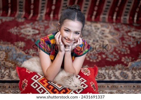 Beautiful girls wearing shirts that are hand-embroidered by hill tribe people but have a modern design in white skirts. Pretty fashionable young girl. Portrait of contemporary fashion of female.