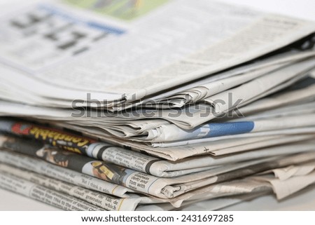 closeup image of a pile of newspaper Royalty-Free Stock Photo #2431697285