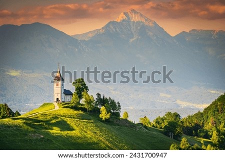 Jamnik, Slovenia - Most famous Saint Primus slovene church, historical Kranj and Kamnik–Savinja Alps Royalty-Free Stock Photo #2431700947