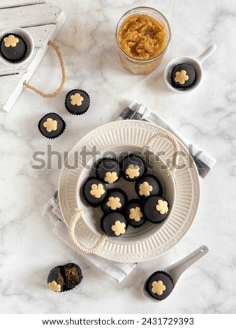 Black nastar, chocolate pineapple tart Royalty-Free Stock Photo #2431729393