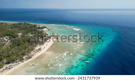 Amazing aerial view of Gili Trawangan coastline on a sunny day, Indonesia.