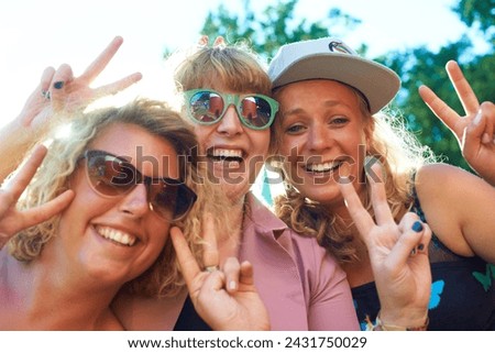 Peace, group and selfie outdoor for holiday, photography and women for portrait. Nature, friends and blue sky in summer, vacation and happy with getaway and excited with a smile and finger gesture