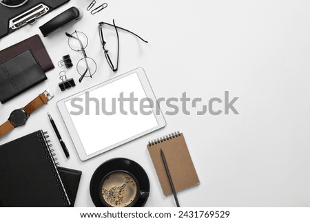 Flat lay composition with modern tablet on white background. Space for text
