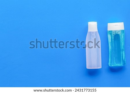 Face cleaning. Organic cosmetics. Mycelial water, lotion for skin care on blue background flat lay space for text Royalty-Free Stock Photo #2431773155