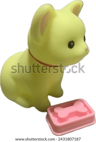 Yellow Dog rubber toy with pink bone isolated on white background