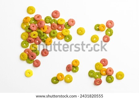 Fruit Ring Colorful corn rings (Fruit rings) Cereal background. Colorful breakfast food. Cereal fruit rings isolated on white background. top view.