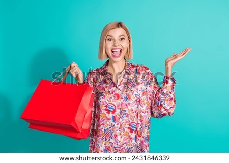 Photo portrait of pretty young girl excited scream enjoy shopping dressed stylish pink print outfit isolated on aquamarine color background