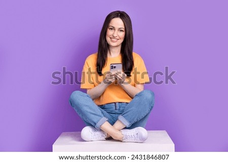 Full body size photo of sitting on podium woman busy using smartphone searching partners contacts isolated over purple color background
