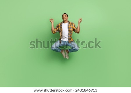 Full body photo of calm focused positive person jump fly meditate isolated on green color background
