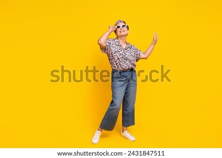 Full size photo of pretty retired female dance summer sales wear trendy leopard print outfit isolated on yellow color background