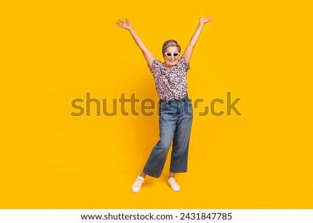 Full body photo of attractive pensioner woman raise hands sunglass wear trendy leopard print clothes isolated on yellow color background