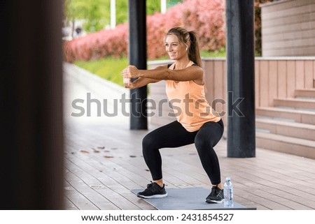  The athlete leads a healthy lifestyle. Cardio training for weight loss. Sports and clothing for women. Fitness break in the city. Beautiful female jogger doing workout