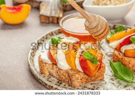 Healthy salad with fresh cheese and peaches on toast. Healthy food concept. place for text, top view.