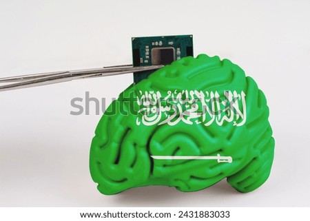 On a white background, a model of the brain with a picture of a flag - Saudi Arabia, a microcircuit, a processor, is implanted into it. Close-up