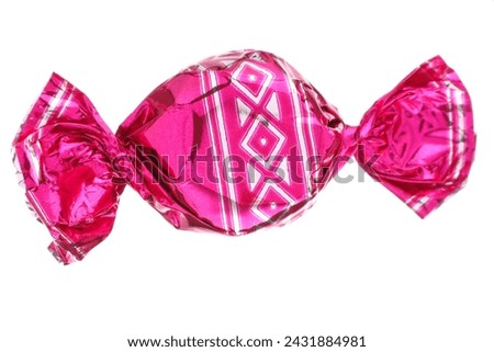 Candy in bright pink wrapper isolated on white Royalty-Free Stock Photo #2431884981
