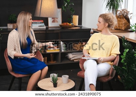 A focused conversation unfolds between a coach and a mentee, reflecting a collaborative approach to achieving professional and business milestones or talking therapy session. High quality photo