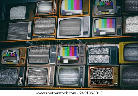 Wall of old retro TV screens, black and white static noise caused by bad signal reception. Distorted television bars signal. Error on the test signal