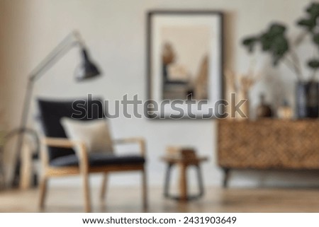 Blurred view of modern living room with sofa and soft bench. room interior with  couch, armchair and coffee table or shelving units. stylish living room. comfortable workplace near big window. Royalty-Free Stock Photo #2431903649