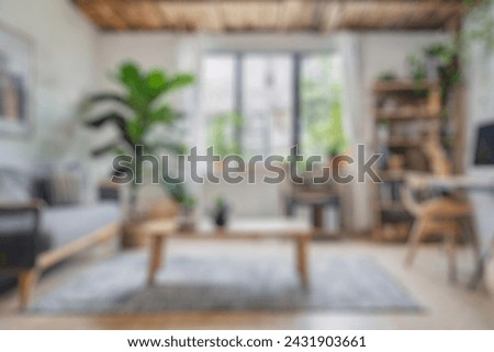 Blurred view of modern living room with sofa and soft bench. room interior with  couch, armchair and coffee table or shelving units. stylish living room. comfortable workplace near big window. Royalty-Free Stock Photo #2431903661
