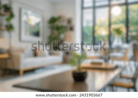 Blurred view of modern living room with sofa and soft bench. room interior with  couch, armchair and coffee table or shelving units. stylish living room. comfortable workplace near big window. Royalty-Free Stock Photo #2431903667