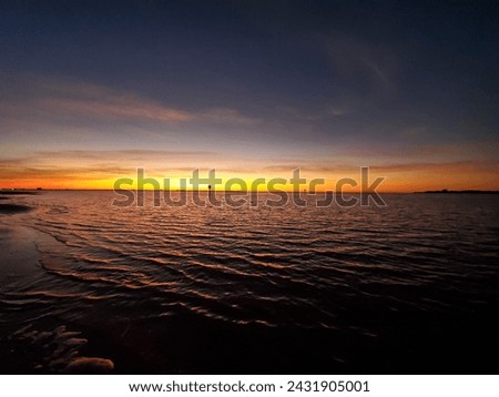 St Petersburg FL - Sunset Over Gandy Beach Royalty-Free Stock Photo #2431905001