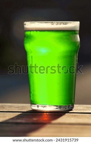 This is a picture of a glass of green beer.