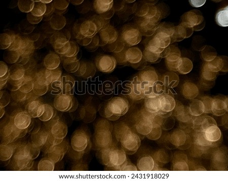 Out-of-focus lights creating a bokeh effect in warm tones.