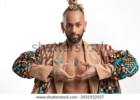 Patience, calmness and meditation concept. Peaceful relieved bearded young man practices yoga exercise, keeps hands in zen gesture, closes eyes, isolated on white background
