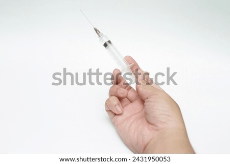 the syringe in my hand with white background
