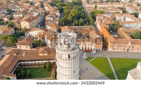Pisa, Italy. Famous Leaning Tower and Pisa Cathedral in Piazza dei Miracoli. Summer. Morning hours, Aerial View   Royalty-Free Stock Photo #2432002469