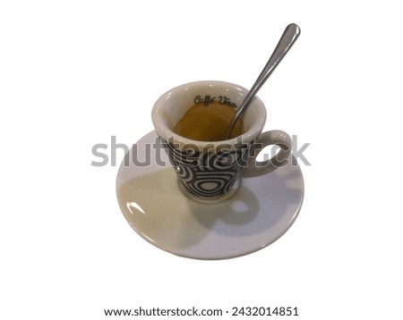 Freshly brewed espresso in a stylish cup with a saucer and spoon, isolated on white background