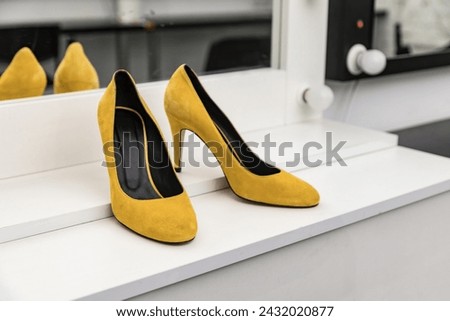 Women's elegant classic high-heeled shoes in yellow