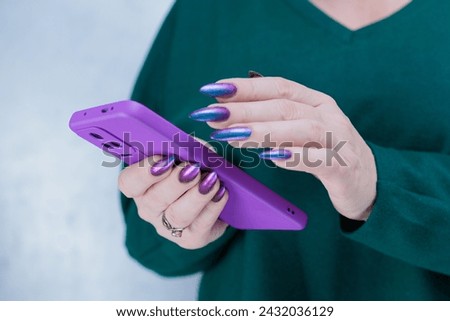 Female hands holding a large smartphone