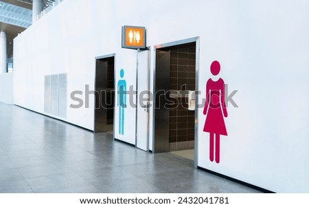 Men and women toilet sign on the wall