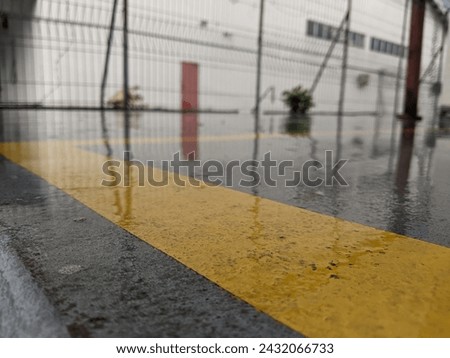 wet floor with yellow lines