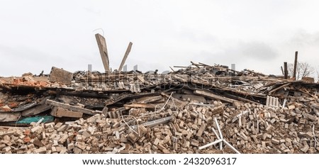 War in Ukraine. A school and school library in Donetsk region of Ukraine is seen destroyed by rocket and artillery fire. Royalty-Free Stock Photo #2432096317