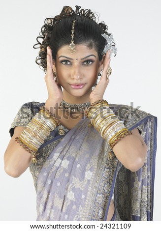 Gorgeous young girl with hand full of beautiful fancy bangles