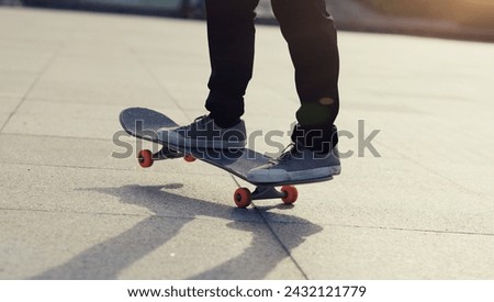 Skateboarder riding skateboard in city