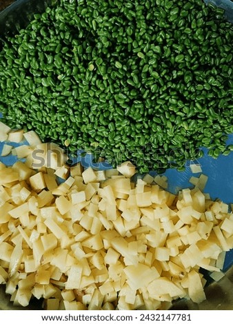 Potatoes cut into cubes and kept with raw fenugreek seeds Royalty-Free Stock Photo #2432147781