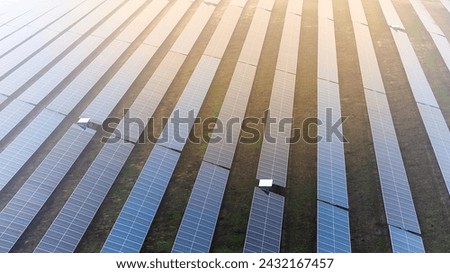 A picture showcasing a vast, contemporary photovoltaic solar farm. Royalty-Free Stock Photo #2432167457